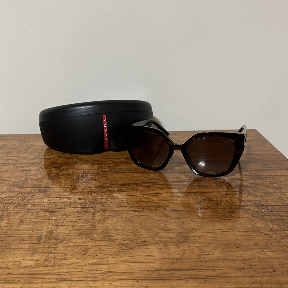 New Prada sunglasses, tortoise frame with black temple, never worn